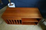 Vintage Danish Mid Century Teak Media Unit with sculpted drawer pull and record storage on casters