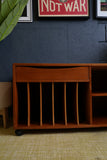 Vintage Danish Mid Century Teak Media Unit with sculpted drawer pull and record storage on casters