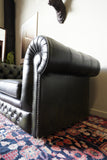 Vintage olive green leather Chesterfield two seater club sofa with deep buttoning and scroll arms