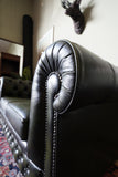 Vintage olive green leather Chesterfield two seater club sofa with deep buttoning and scroll arms