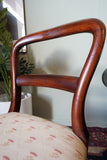 Victorian mahogany balloon back chair with brass castors and newly reupholstered patterned seat
