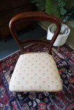 Victorian mahogany balloon back chair with brass castors and newly reupholstered patterned seat