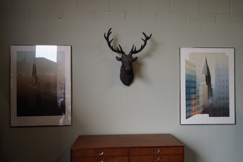 Pair of large framed architectural prints by Richard Davies depicting the Chrysler Building and Empire State Building mounted on wall