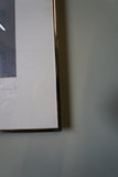 Pair of large framed architectural prints by Richard Davies depicting the Chrysler Building and Empire State Building mounted on wall