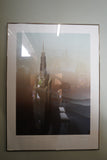 Pair of large framed architectural prints by Richard Davies depicting the Chrysler Building and Empire State Building mounted on wall