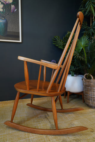 Timeless Tranquillity: Mid-Century Ercol Blonde Elm Rocking Chair by Lucian Ercolani